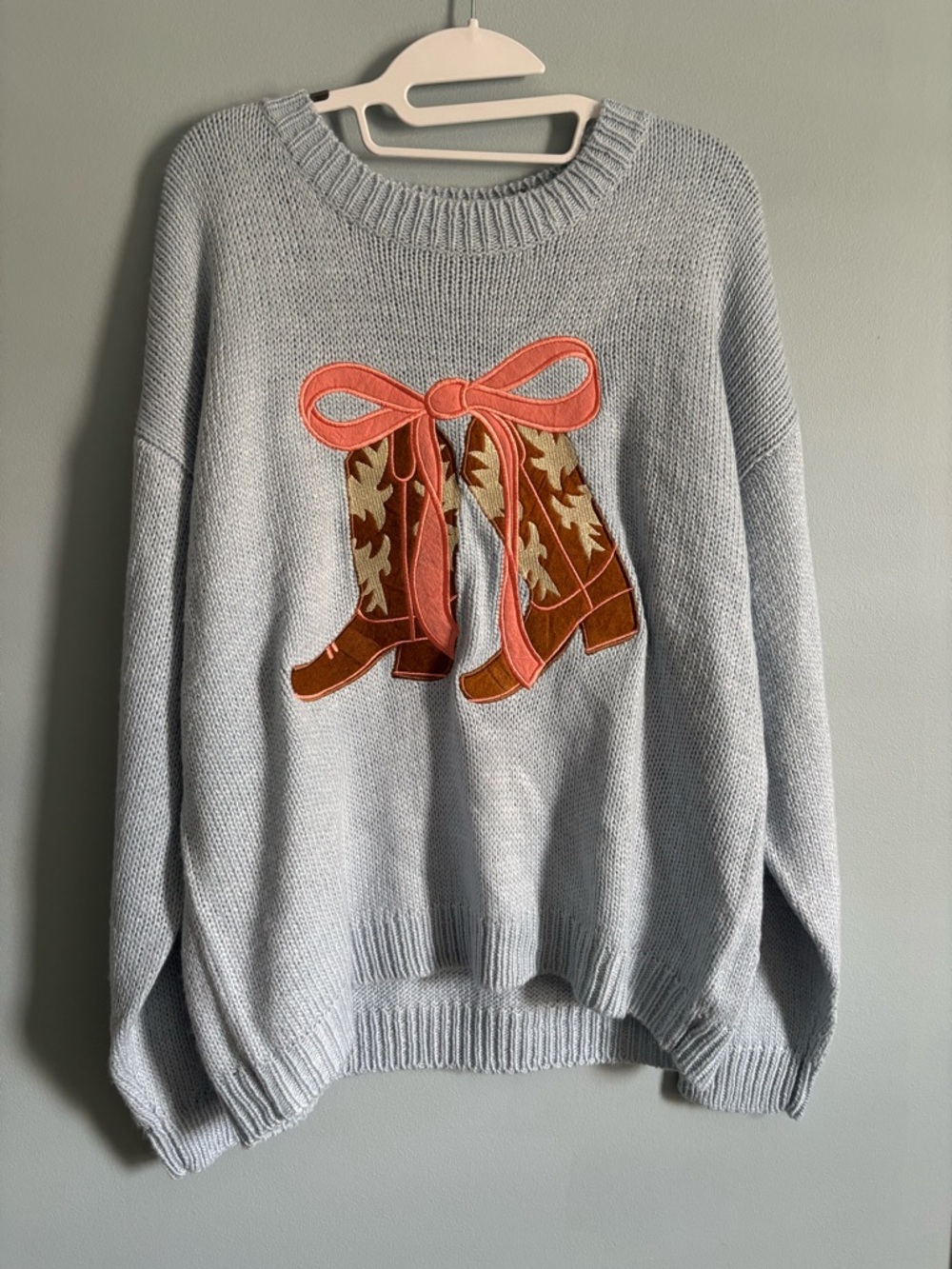 Light Blue Women’s Sweater with Western Boots and Bow
